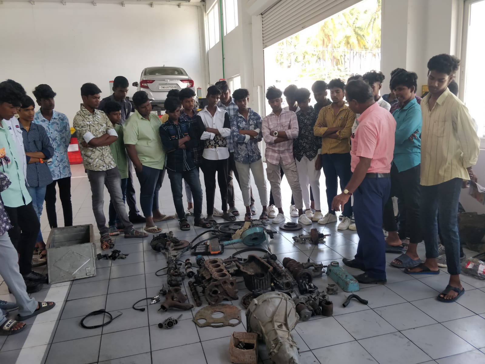 Practical training session with engine components